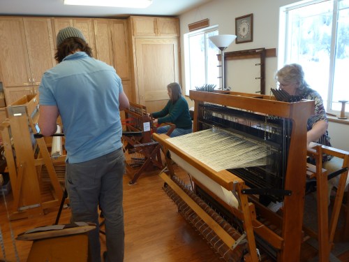 Cathie weaving a red scarf