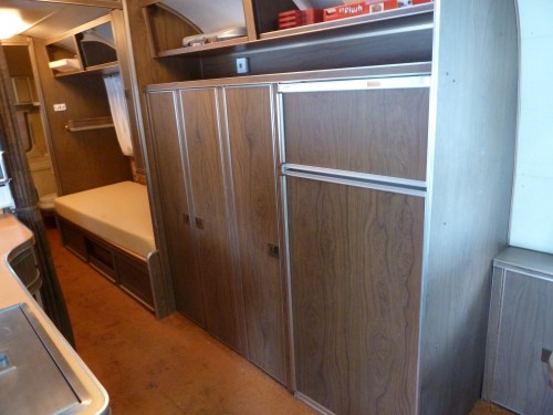 refrigerator and storage across from the galley